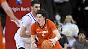 Feb 22, 2025; Dallas, Texas, USA; SMU Mustangs center Samet Yigitoglu (24) and Clemson Tigers forward Ian Schieffelin (4) in action during the game between the SMU Mustangs and the Clemson Tigers at Moody Coliseum.