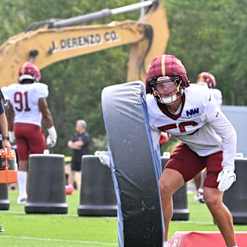 Washington Commanders linebacker Kain Medrano works with a training aid at training camp at Gillette Stadium.