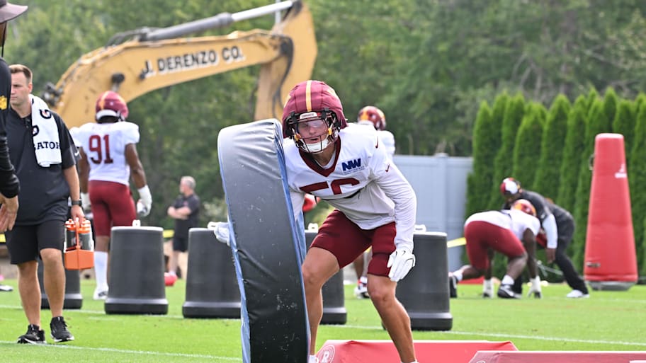 Washington Commanders linebacker Kain Medrano works with a training aid at training camp at Gillette Stadium. | Eric Canha-Imagn Images