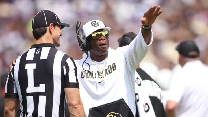 Sep 2, 2023; Fort Worth, Texas, USA; Colorado Buffaloes head coach Deion Sanders talks to line judge Bret bascule in the second quarter against the TCU Horned Frogs at Amon G. Carter Stadium. Mandatory Credit: Tim Heitman-USA TODAY Sports