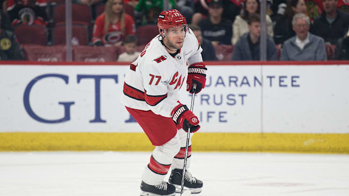 Apr 14, 2024; Chicago, Illinois, USA;  Carolina Hurricanes defenseman Tony DeAngelo (77) skates against the Chicago Blackhawks at United Center. Mandatory Credit: Jamie Sabau-Imagn Images