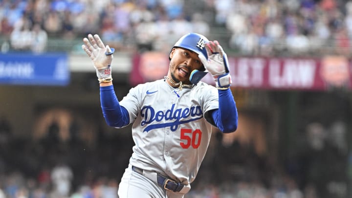 Aug 12, 2024; Milwaukee, Wisconsin, USA; Los Angeles Dodgers right field Mookie Betts (50) rounds the bases after hitting a home run against the Milwaukee Brewers at American Family Field. Mandatory Credit: Michael McLoone-USA TODAY Sports