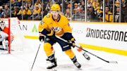 Nov 27, 2024; Nashville, Tennessee, USA;  Nashville Predators center Tommy Novak (82) skates behind the net against the Philadelphia Flyers during the third period at Bridgestone Arena. Mandatory Credit: Steve Roberts-Imagn Images