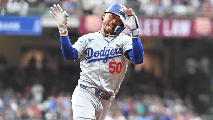 Aug 12, 2024; Milwaukee, Wisconsin, USA; Los Angeles Dodgers right field Mookie Betts (50) rounds the bases after hitting a home run against the Milwaukee Brewers at American Family Field. Mandatory Credit: Michael McLoone-USA TODAY Sports