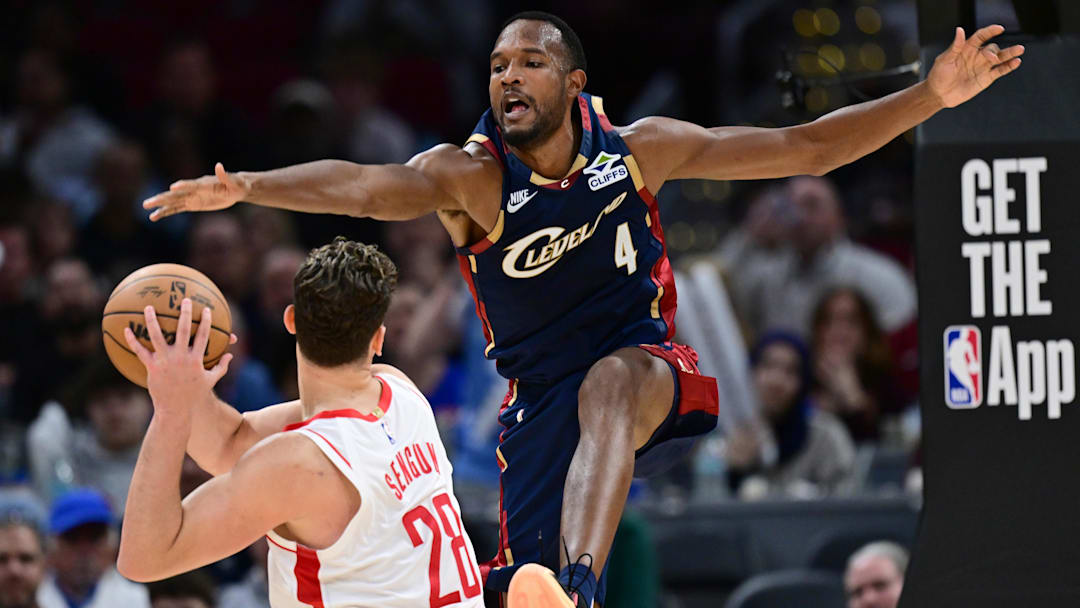 Nov 19, 2025; Cleveland, Ohio, USA; Cleveland Cavaliers center Evan Mobley (4) pressured Houston Rockets center Alperen Sengun (28) during the second half at Rocket Arena. Mandatory Credit: David Dermer-Imagn Images
