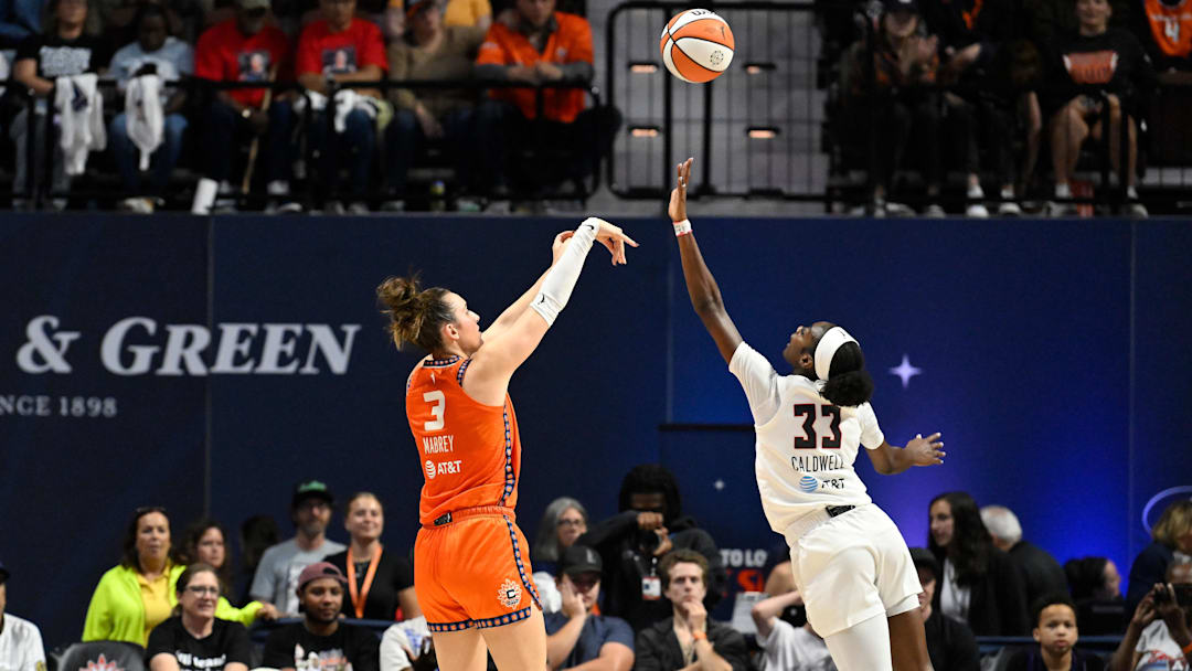 Sep 10, 2025; Uncasville, Connecticut, USA; Connecticut Sun guard Marina Mabrey (3) shoots over Atlanta Dream guard Maya Caldwell (33) during the first half at Mohegan Sun Arena.