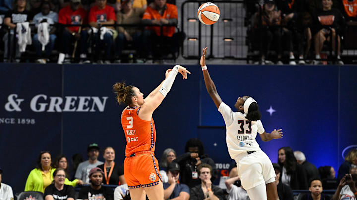 Sep 10, 2025; Uncasville, Connecticut, USA; Connecticut Sun guard Marina Mabrey (3) shoots over Atlanta Dream guard Maya Caldwell (33) during the first half at Mohegan Sun Arena.