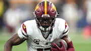 Dec 17, 2023; Inglewood, California, USA; Washington Commanders wide receiver Terry McLaurin (17) carries the ball against the Los Angeles Rams in the second half at SoFi Stadium. Mandatory Credit: Kirby Lee-Imagn Images