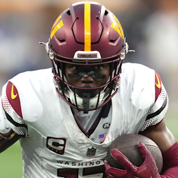 Dec 17, 2023; Inglewood, California, USA; Washington Commanders wide receiver Terry McLaurin (17) carries the ball against the Los Angeles Rams in the second half at SoFi Stadium. Mandatory Credit: Kirby Lee-Imagn Images