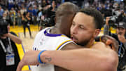 Dec. 25, 2024; San Francisco, California, USA; Golden State Warriors guard Stephen Curry (center right) greets Los Angeles Lakers forward LeBron James (center left) after the game at Chase Center.