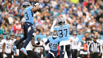 Dec 8, 2024; Nashville, Tennessee, USA;  Tennessee Titans cornerback Chidobe Awuzie (13) intercepts the pass thrown by Jacksonville Jaguars quarterback Mac Jones (10) during the first half at Nissan Stadium. Mandatory Credit: Steve Roberts-Imagn Images