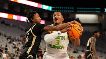 Mar 16, 2024; Fort Worth, TX, USA;  South Florida Bulls guard Chris Youngblood (3) drives to the basket and is fouled by UAB Blazers guard Eric Gaines (4) during the first half at Dickies Arena. Mandatory Credit: Chris Jones-Imagn Images