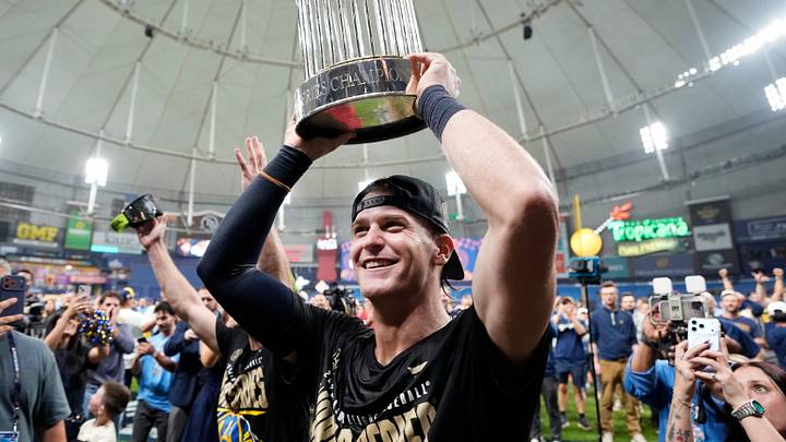 Milwaukee Brewers shortstop Cooper Pratt (12) lifts the Commissioner's Trophy after winning the World Series against the Tampa Bay Rays at Tropicana Field on in St.Petersburg, Florida on Oct. 28, 2026.