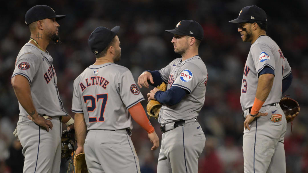 Jun 8, 2024; Anaheim, California, USA;  Houston Astros first baseman Jose Abreu (79), second baseman Jose Altuve (27), third baseman Alex Bregman (2) and shortstop Jeremy Pena (3) talk on the field during a pitching change in the eighth inning against the Los Angeles Angels at Angel Stadium. 