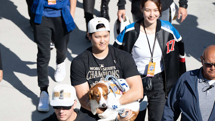 Los Angeles Dodger Shohei Ohtani, wife Mamiko Tanaka and dog Decoy arrive at Dodger Stadium for the team’s World Series Championship celebration.