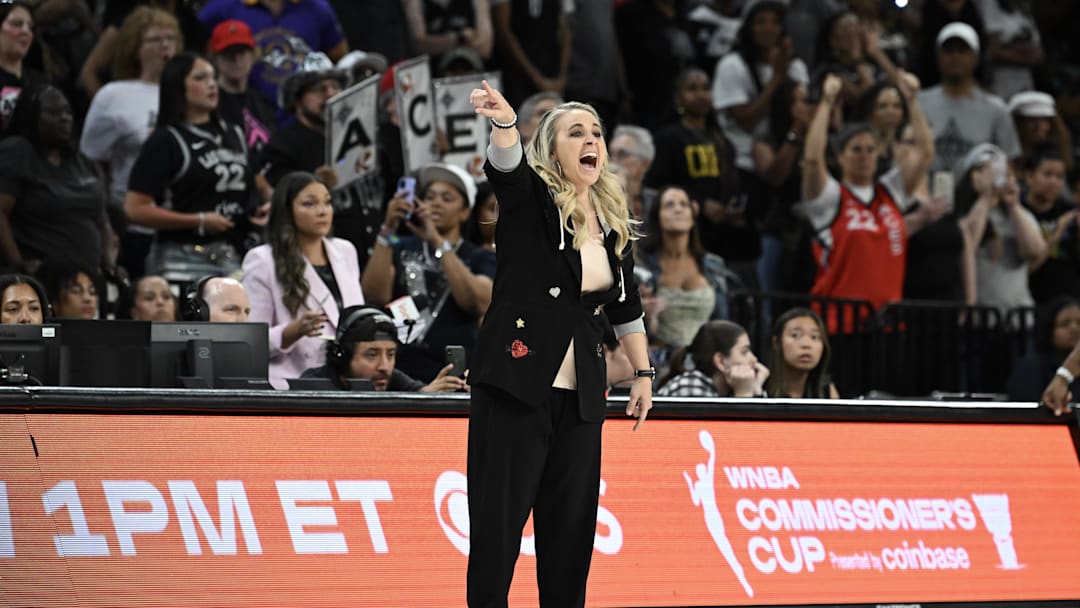 Jun 13, 2025; Las Vegas, Nevada, USA; Las Vegas Aces head coach Becky Hammon gestures to her team in the fourth quarter of their game against the Dallas Wings at Michelob Ultra Arena. 
