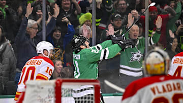Mar 6, 2025; Dallas, Texas, USA; Dallas Stars left wing Jason Robertson (21) celebrates after he scores the game winning goal against Calgary Flames goaltender Dan Vladar (80) during the overtime period at the American Airlines Center. Mandatory Credit: Jerome Miron-Imagn Images