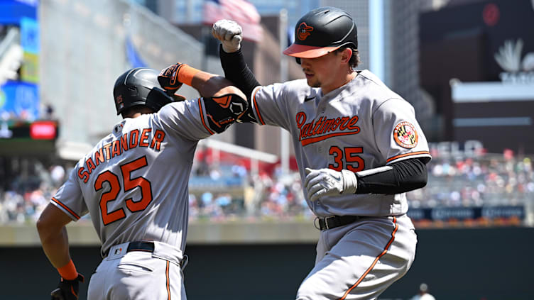 Jul 9, 2023; Minneapolis, Minnesota, USA; Baltimore Orioles catcher Adley Rutschman (35) celebrates a home run with teammate Anthony Santander