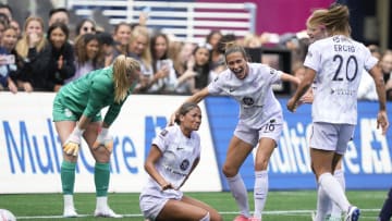 Jun 23, 2024; Seattle, Washington, USA; Racing Louisville FC forward Reilly Turner (66) and midfielder Jaelin Howell (6) celebrates a goal in the second half against Seattle Reign FC at Lumen Field. Mandatory Credit: Stephen Brashear-USA TODAY Sports