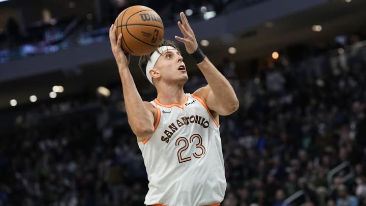 Dec 19, 2023; Milwaukee, Wisconsin, USA; San Antonio Spurs center Zach Collins (23) shoots during the third quarter against the Milwaukee Bucks at Fiserv Forum. 