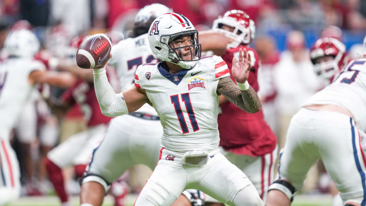 Dec 28, 2023; San Antonio, TX, USA;  Arizona Wildcats quarterback Noah Fifita (11) throws a pass in the first half against the Oklahoma Sooners at Alamodome. 