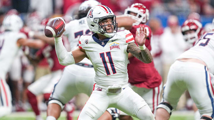 Dec 28, 2023; San Antonio, TX, USA;  Arizona Wildcats quarterback Noah Fifita (11) throws a pass in the first half against the Oklahoma Sooners at Alamodome. Mandatory Credit: Daniel Dunn-Imagn Images