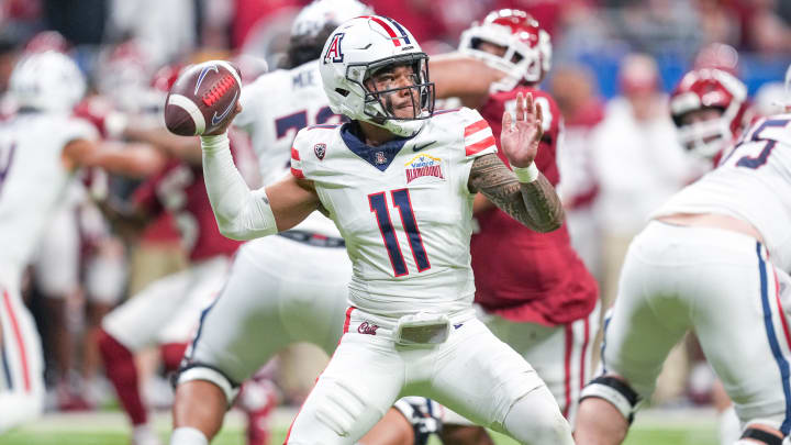 Dec 28, 2023; San Antonio, TX, USA;  Arizona Wildcats quarterback Noah Fifita (11) throws a pass in the first half against the Oklahoma Sooners at Alamodome.