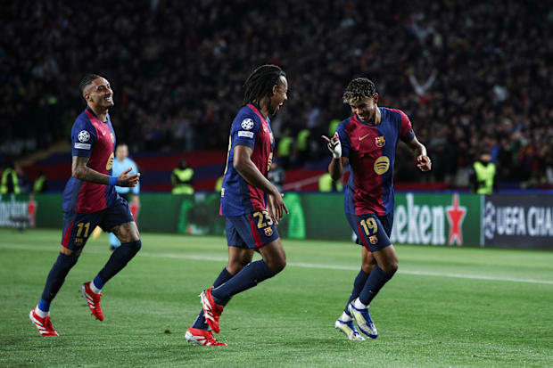 Lamine Yamal celebrates scoring for Barcelona with Raphinha and Jules Kounde