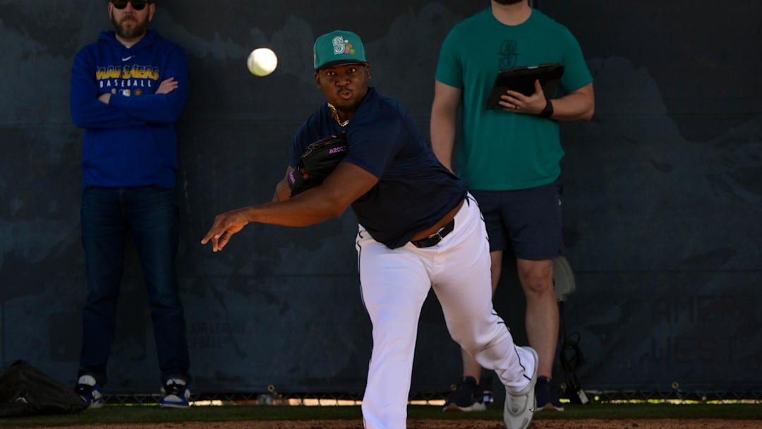 Feb 12, 2026; Peoria, AZ, USA;  Seattle Mariners pitcher Jose A. Ferrer  throws during a Spring Training workout at Peoria Sports Complex. Mandatory Credit: Matt Kartozian-Imagn Images