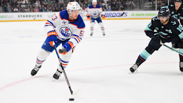 Mar 27, 2025; Seattle, Washington, USA; Edmonton Oilers center Jeff Skinner (53) advances the puck against the Seattle Kraken during the first period at Climate Pledge Arena. Mandatory Credit: Steven Bisig-Imagn Images