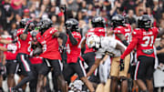 Oct 11, 2025; Cincinnati, Ohio, USA; Cincinnati Bearcats defensive back Jiquan Sanks (9) recovers the ball on a possession against the UCF Knights in the first half at Nippert Stadium. Mandatory Credit: Aaron Doster-Imagn Images