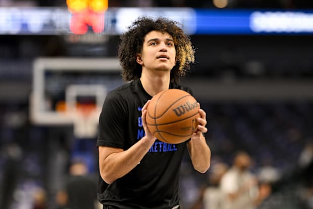 Orlando Magic guard Anthony Black preparing for an NBA game against the Dallas Mavericks.