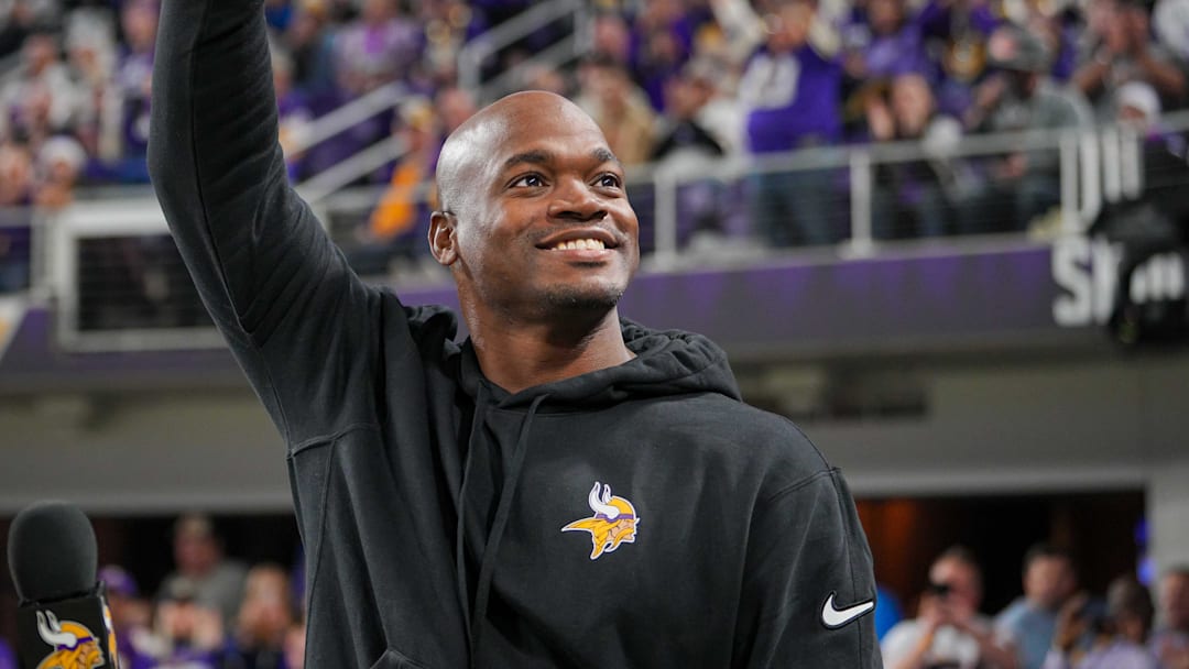 Nov 27, 2023; Minneapolis, Minnesota, USA; Ex Minnesota Viking Adrian Peterson salutes the crowd in the third quarter in a game against the Chicago Bears at U.S. Bank Stadium.