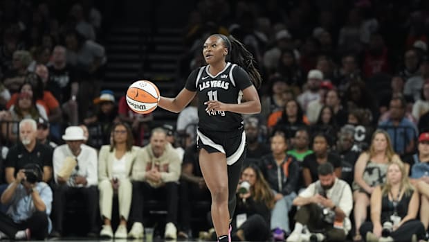 A photo of Dana Evans dribbling the ball