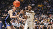 Feb 11, 2025; Morgantown, West Virginia, USA; West Virginia Mountaineers guard Sencire Harris (10) passes the ball during the first half against the Brigham Young Cougars at WVU Coliseum. Mandatory Credit: Ben Queen-Imagn Images