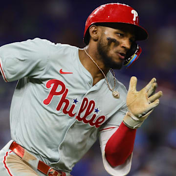 Sep 6, 2024; Miami, Florida, USA; Philadelphia Phillies center fielder Johan Rojas (18) runs toward second base after hitting an RBI double against the Miami Marlins during the fifth inning at loanDepot Park