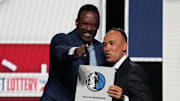 Rolando Blackman of the Dallas Mavericks reacts with Mark Tatum NBA Deputy Commissioner after winning the the first pick during the 2025 NBA Draft Lottery.