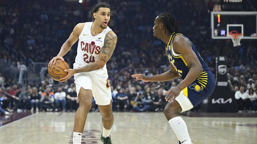 Apr 13, 2025; Cleveland, Ohio, USA; Cleveland Cavaliers forward Jaylon Tyson (24) looks to pass beside Indiana Pacers forward Aaron Nesmith (23) in the first quarter at Rocket Arena. Mandatory Credit: David Richard-Imagn Images