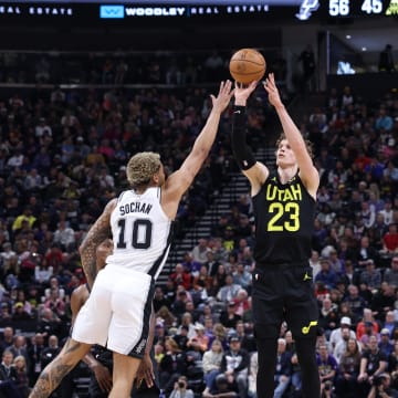 Mar 27, 2024; Salt Lake City, Utah, USA; Utah Jazz forward Lauri Markkanen (23) takes a three point shot over San Antonio Spurs forward Jeremy Sochan (10) during the second quarter at Delta Center. Mandatory Credit: Rob Gray-USA TODAY Sports