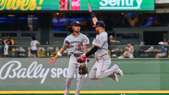 Jul 13, 2024; Milwaukee, Wisconsin, USA; Washington Nationals shortstop C.J. Abrams (5) celebrates with second baseman Luis Garcia (2) after beating the Milwaukee Brewers at American Family Field.