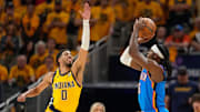 Jun 19, 2025; Indianapolis, Indiana, USA; Indiana Pacers guard Tyrese Haliburton (0) defends against a shot by Oklahoma City Thunder guard Luguentz Dort (5) in the third quarter during game six of the 2025 NBA Finals at Gainbridge Fieldhouse. Mandatory Credit: Kyle Terada-Imagn Images