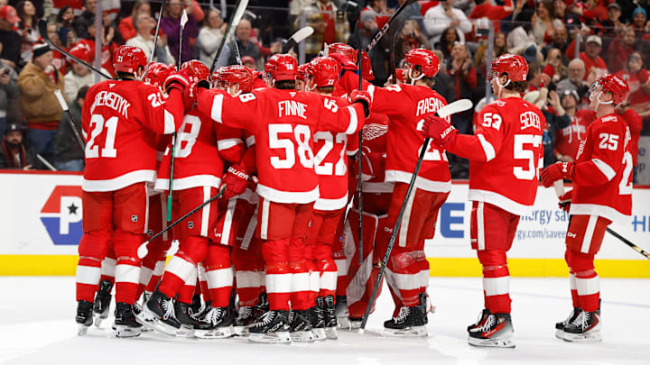 Jan 29, 2026; Detroit, Michigan, USA;  Detroit Red Wings right wing Patrick Kane (88) receives congratulations from teammates after he gets his 1375 point in the second period against the Washington Capitals at Little Caesars Arena. Mandatory Credit: Rick Osentoski-Imagn Images