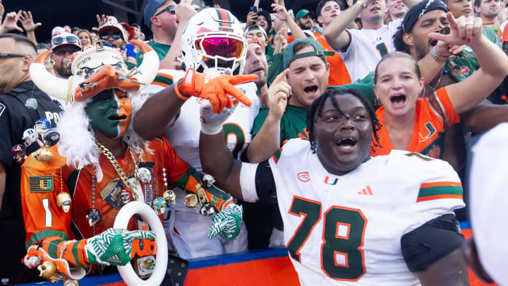 Miami Hurricanes offensive lineman Matthew McCoy (78) celebrates with fans after defeating the Gators during the season opener at Ben Hill Griffin Stadium in Gainesville, FL on Saturday, August 31, 2024 against the University of Miami Hurricanes. The Hurricanes defeated the Gators 41-17. [Doug Engle/Gainesville Sun]