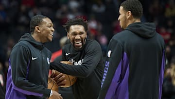 Dec 26, 2023; Portland, Oregon, USA; Sacramento Kings guard De'Aaron Fox (5), left, and guard Malik Monk (0) share a laugh with forward Keegan Murray (13), right, before a game against the Portland Trail Blazers at Moda Center. Mandatory Credit: Troy Wayrynen-Imagn Images
