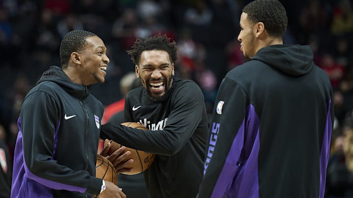 Dec 26, 2023; Portland, Oregon, USA; Sacramento Kings guard De'Aaron Fox (5), left, and guard Malik Monk (0) share a laugh with forward Keegan Murray (13), right, before a game against the Portland Trail Blazers at Moda Center. Mandatory Credit: Troy Wayrynen-USA TODAY Sports