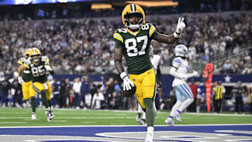 Green Bay Packers wide receiver Romeo Doubs (87) celebrates after scoring a touchdown against the Dallas Cowboys in the fourth quarter at AT&T Stadium. 