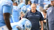 Oct 25, 2025; Chapel Hill, North Carolina, USA; North Carolina Tar Heels head coach Bill Belichick with the team before the game at Kenan Stadium. 