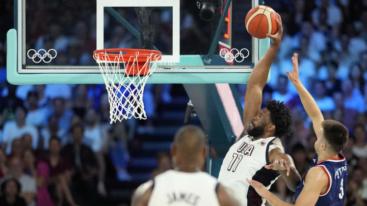 Aug 8, 2024; Paris, France; United States centre Joel Embiid (11) goes to the basket while defended by Serbia centre Filip Petrusev (3) during the first half in a men's basketball semifinal game during the Paris 2024 Olympic Summer Games at Accor Arena. Mandatory Credit: Kyle Terada-USA TODAY Sports