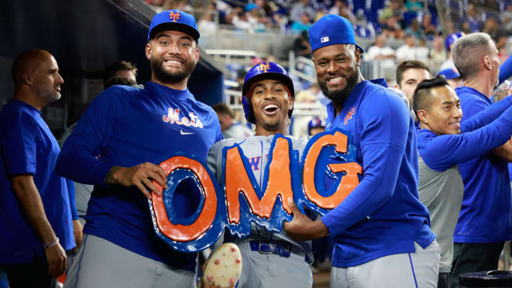 Jul 22, 2024; Miami, Florida, USA;  New York Mets starting pitcher Luis Severino (40) shortstop Francisco Lindor (12)  and New York Mets starting pitcher Sean Manaea (59) celebrate Lindor's home run against the Miami Marlins in the ninth inning at loanDepot Park. Mandatory Credit: Rhona Wise-USA TODAY Sports