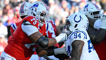 Dec 1, 2024; Foxborough, Massachusetts, USA; New England Patriots offensive tackle Demontrey Jacobs (75) blocks Indianapolis Colts defensive end Tyquan Lewis (94) during the first half at Gillette Stadium. Mandatory Credit: Eric Canha-Imagn Images